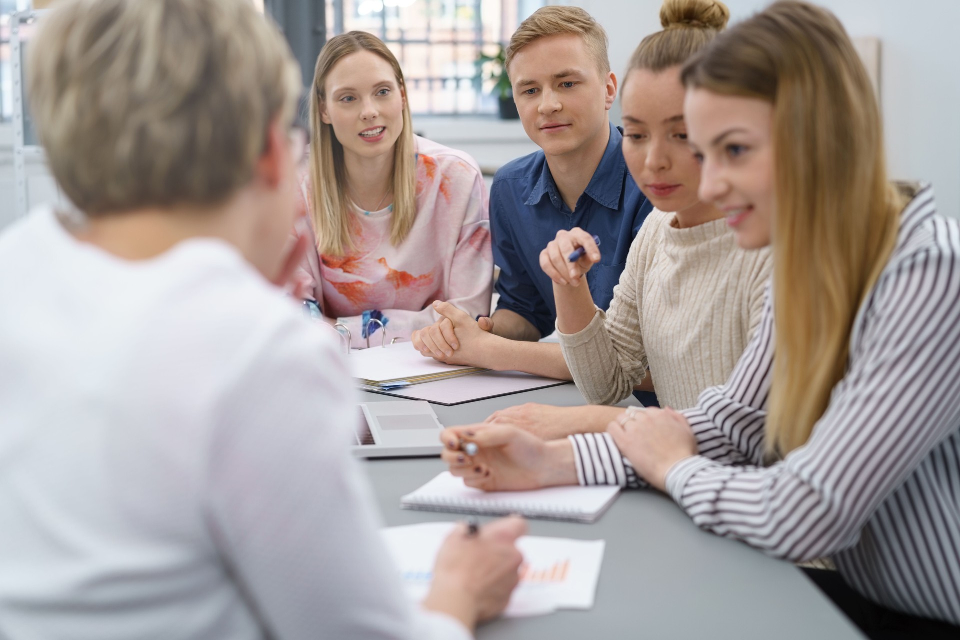 Group of young people in a business meeting