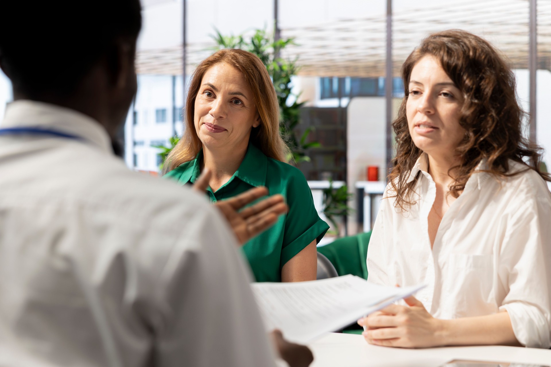 HR experts interviewing man after doing background checks