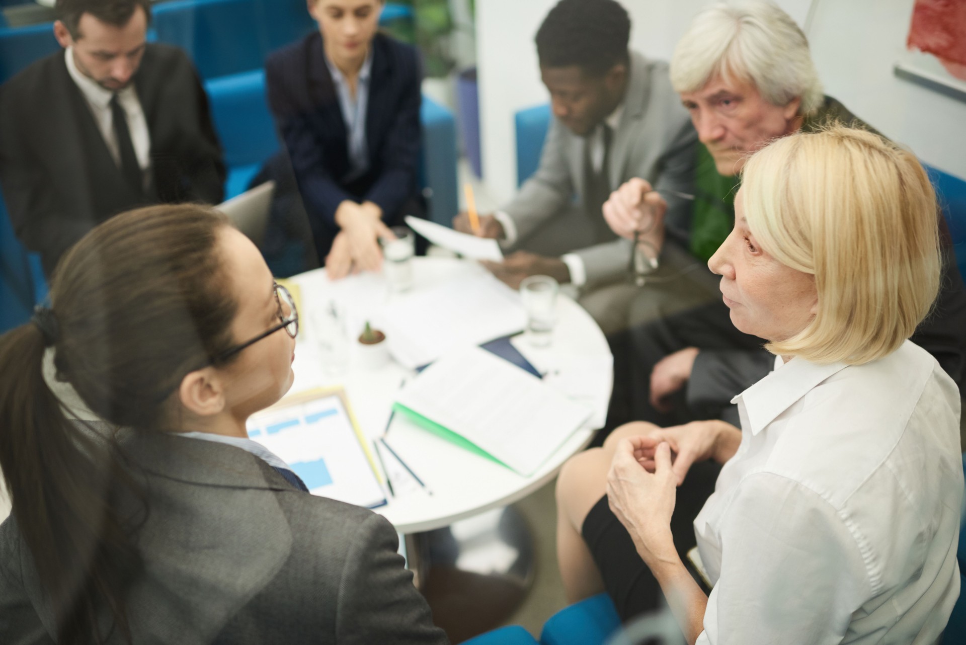 Discussing Work in Business Meeting